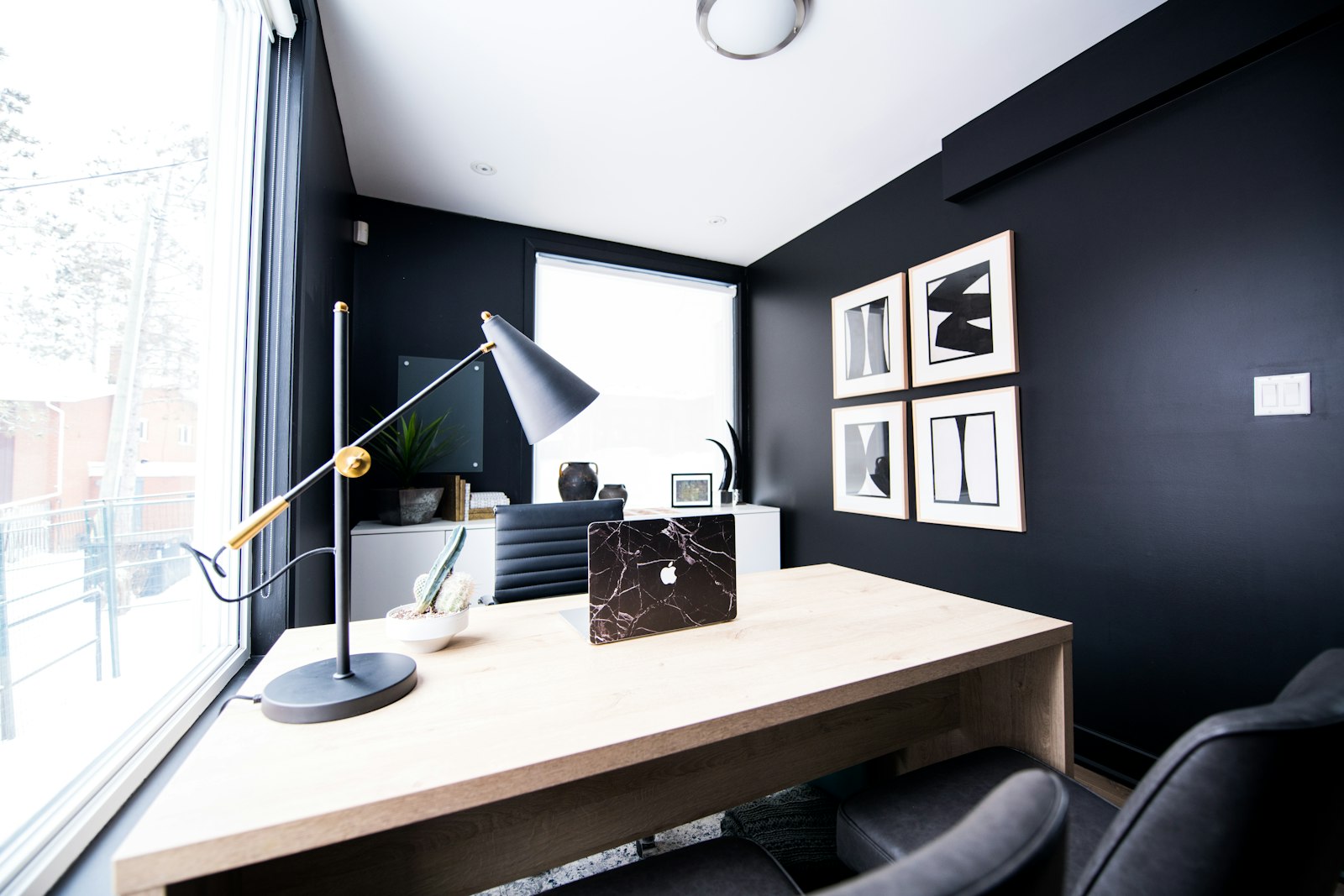 A home office desk with warm ergonomic task lighting