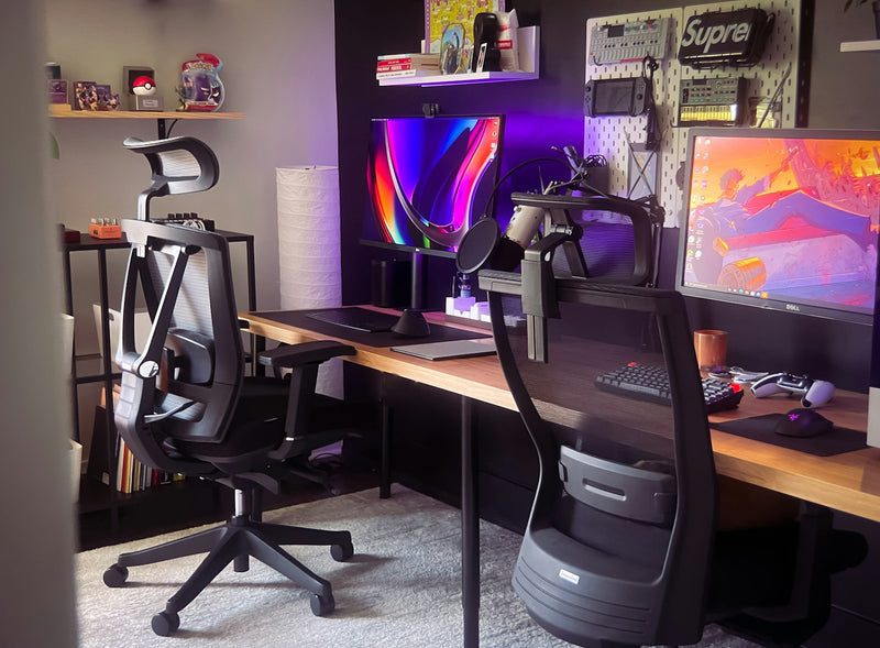 Black ergonomic office chair beside a brown wooden desk