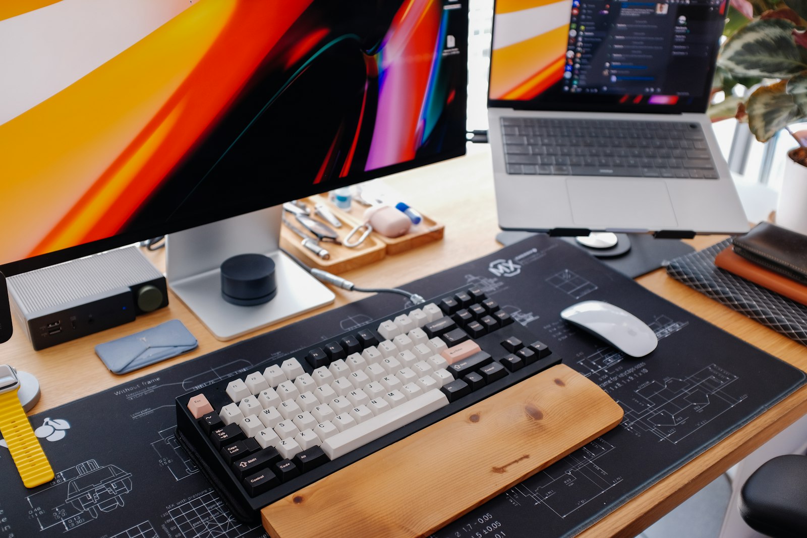 Modern desk setup with a keyboard and monitor in soft daylight