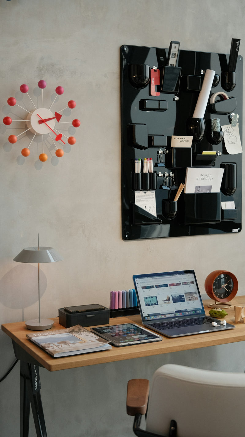 Modern desk with a laptop and a set of organized desk accessories