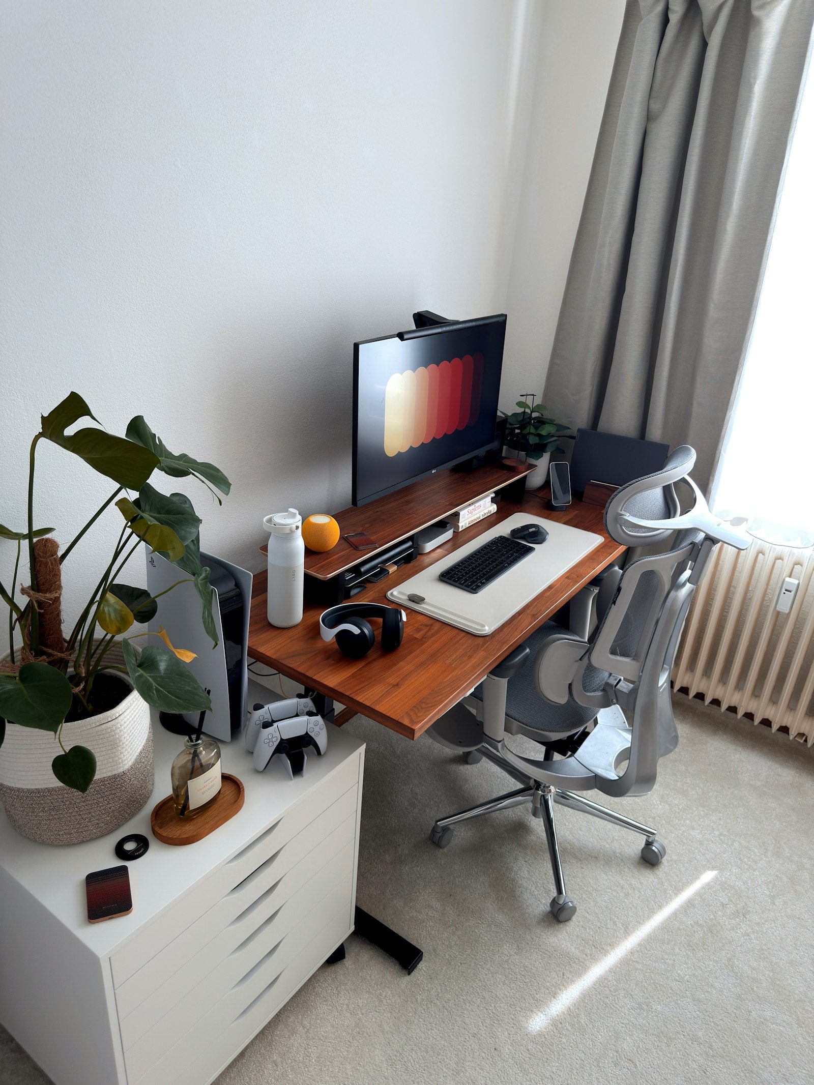 Modern home office with a clean desk and an ergonomic chair in natural light