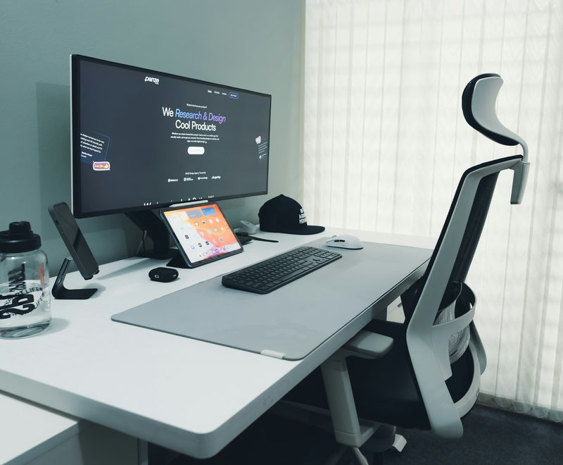 Modern desk setup with an ergonomic office chair in daylight