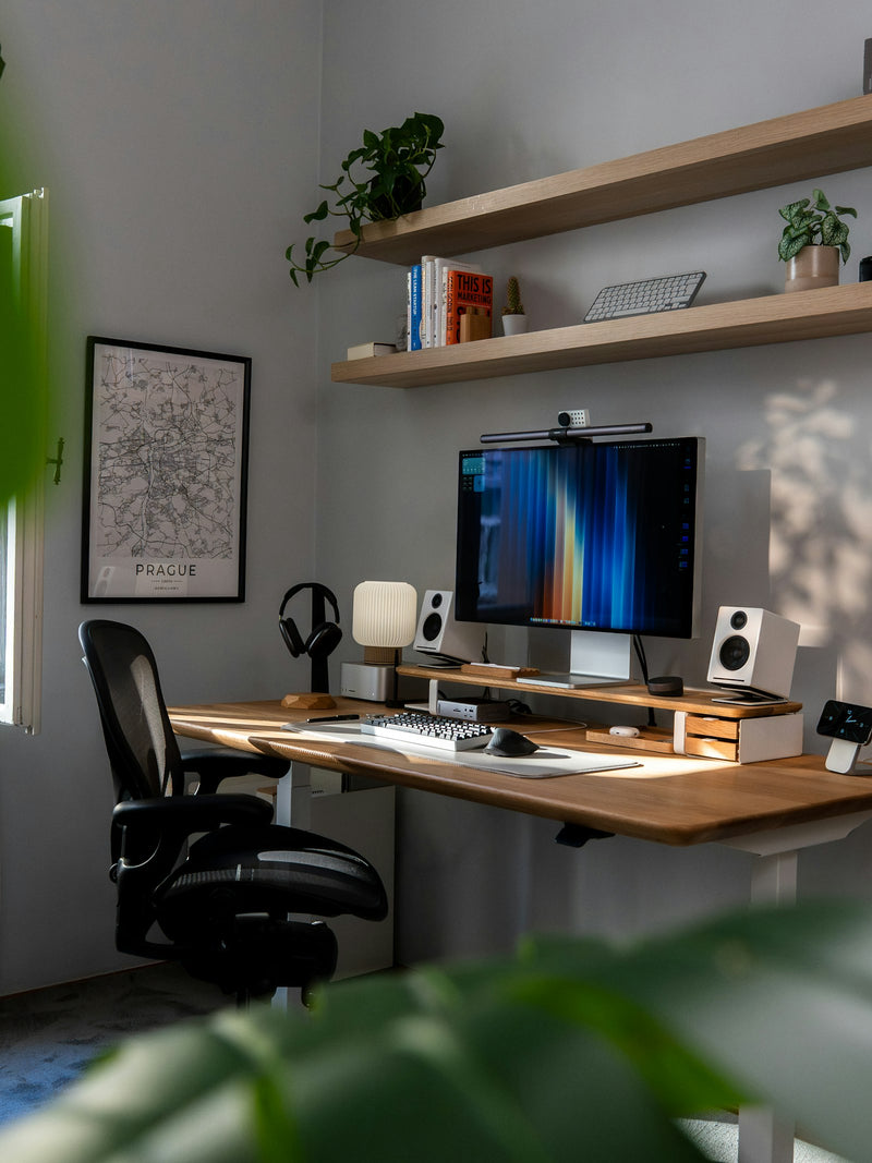 Modern desk setup with a computer and small plants, the considered objects that make a room yours