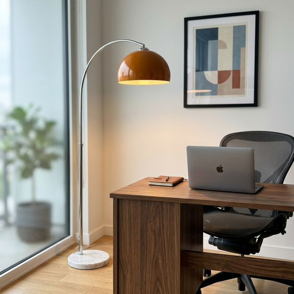 Arc Floor Light, orange in a workspace