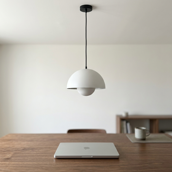 Sculptural Bud Pendant, white in a workspace