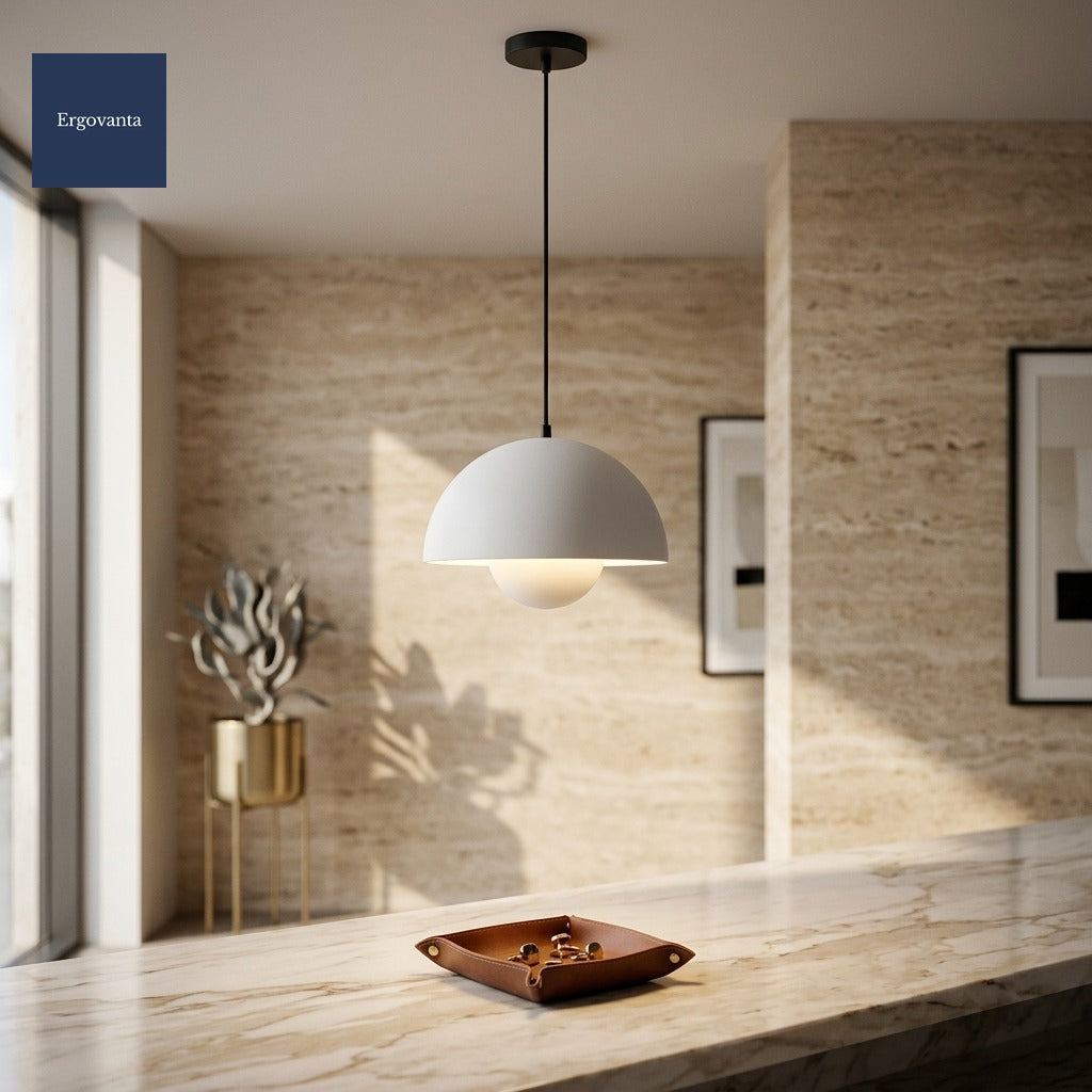 White Sculptural Bud Pendant in a corporate lobby above a marble reception desk against a travertine wall