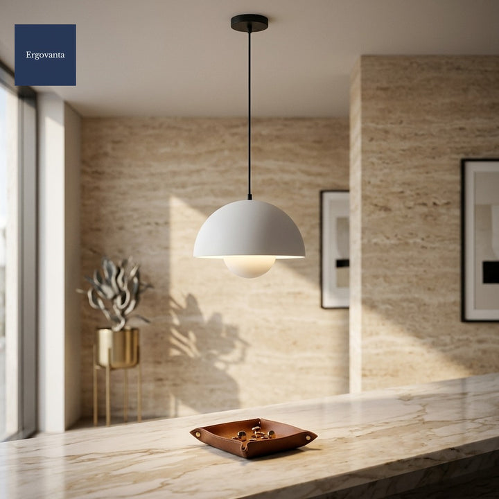 White Sculptural Bud Pendant in a corporate lobby above a marble reception desk against a travertine wall