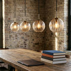 Hand-Blown Colored Glass Pendant Lights, ribbed globe shades over a coworking table