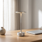 Cordless Disc Table Lamp in Silver on a desk