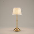 Cordless Pleated-Shade Table Lamp in Gold, studio view