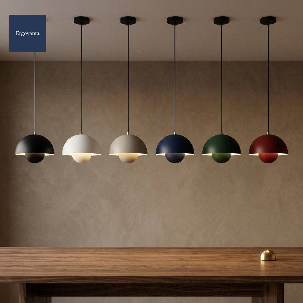 Six Sculptural Bud Pendants hanging in a row over a long walnut boardroom table, showing all six finishes