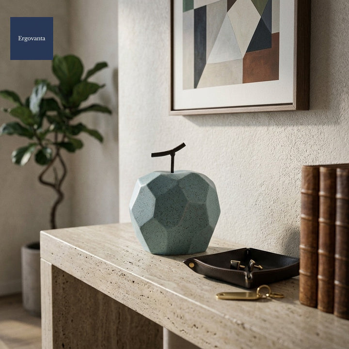 Faceted Porcelain Apple Sculpture - Blue variant on an executive entryway travertine console